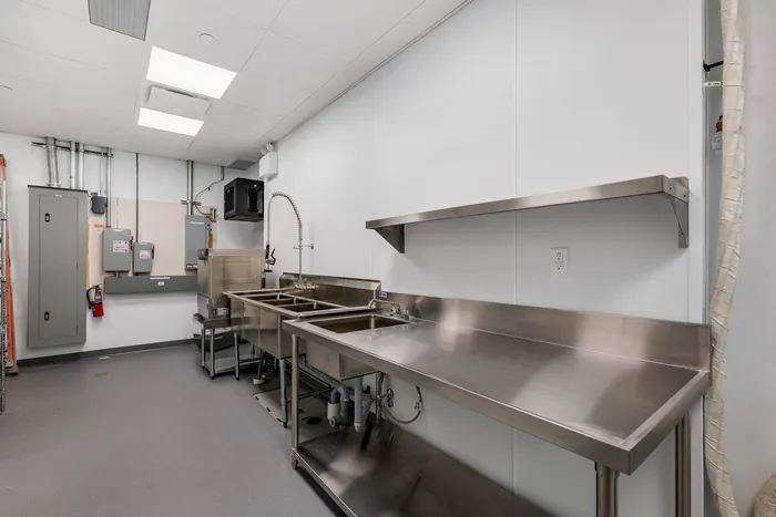 Three-compartment sink line with pre-rinse and floor drainage, Odd Burger, Whitby, Ontario