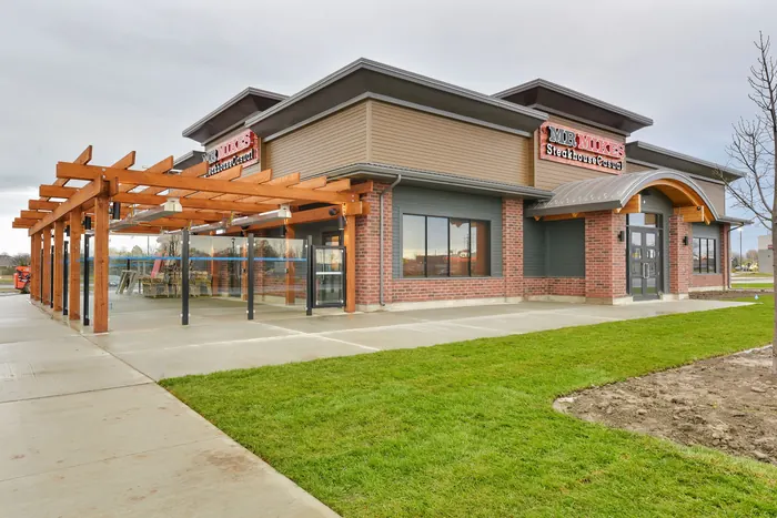Completed building envelope and exterior craft, Mr Mikes Steakhouse, St Catharines, Ontario