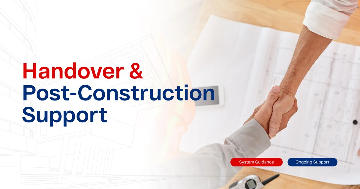 Two people shaking hands over a set of unrolled building plans