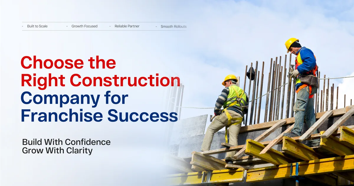 Two workers in hi-vis gear standing on timber formwork at height, working with reinforcing steel